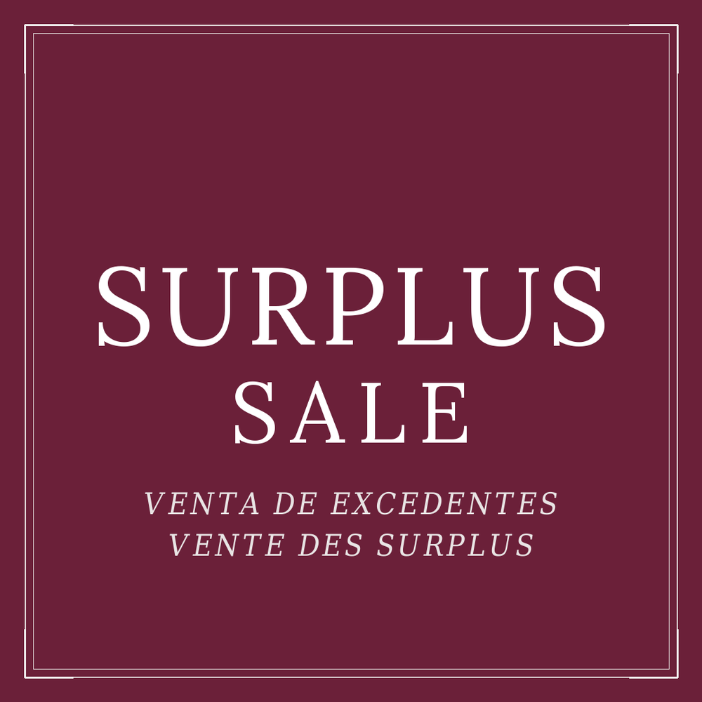 Simple image that says Surplus sale in english spanish and french.  Background is a deep maroon and lettering is in white.