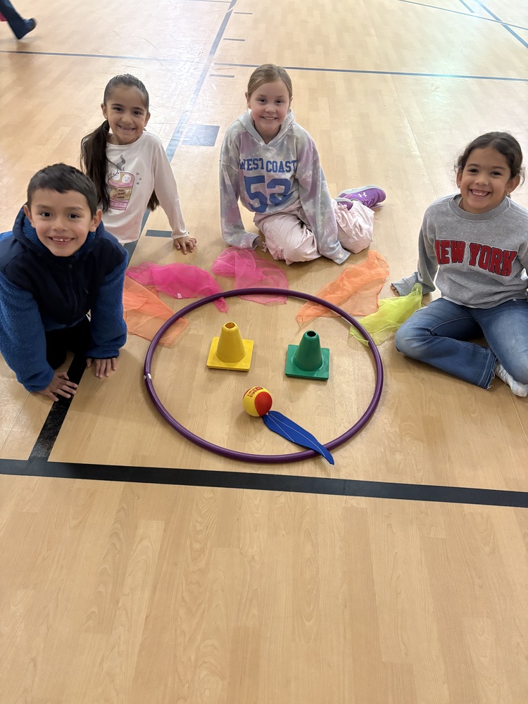 Children sitting and smiling