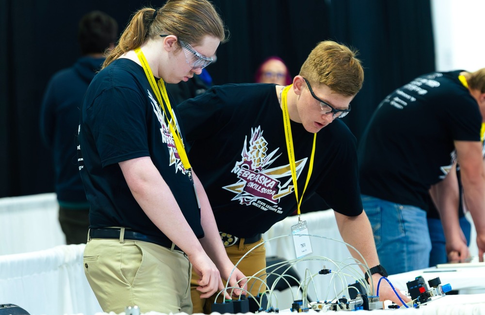 Two Columbus High School students compete in the mechatronics category at the Nebraska SkillsUSA conference.