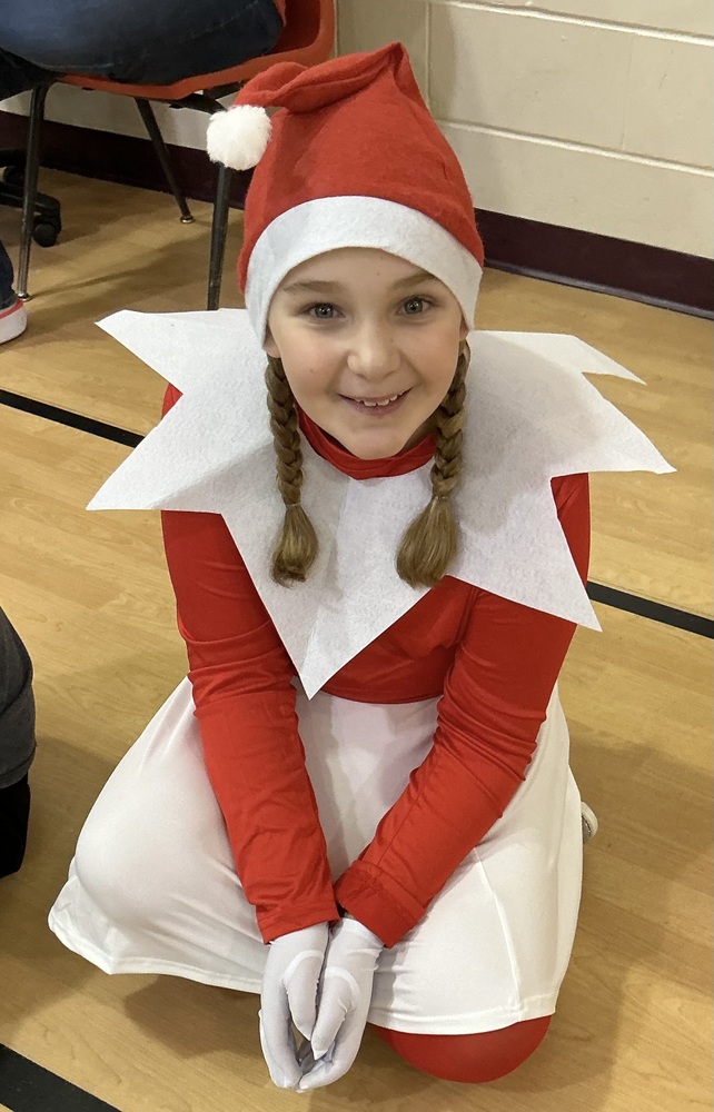 Girl dressed as Santa 's elf