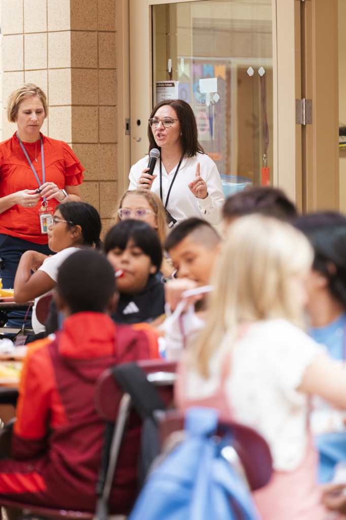 CMS Assistant principal, Katie Rose, addresses a group of 5th graders during their lunch period on their first day.