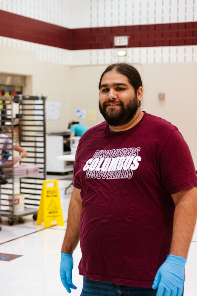 Maintenance staff member Mr. Hunter, smiles in a candid photo taken in the Emerson cafeteria on the first day of school in 2025.