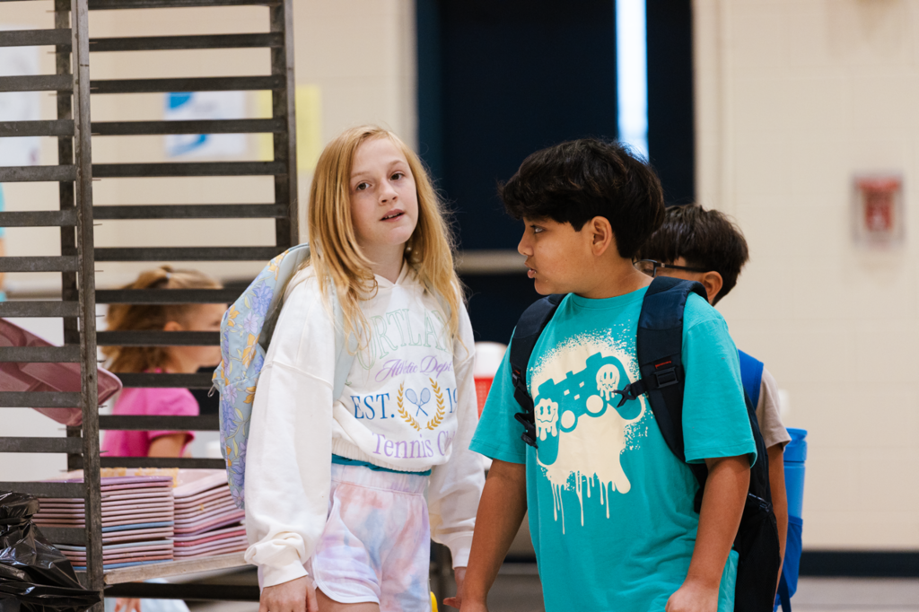 A group of Emerson students are dismissed from breakfast in the cafeteria on their first day of school in 2025.