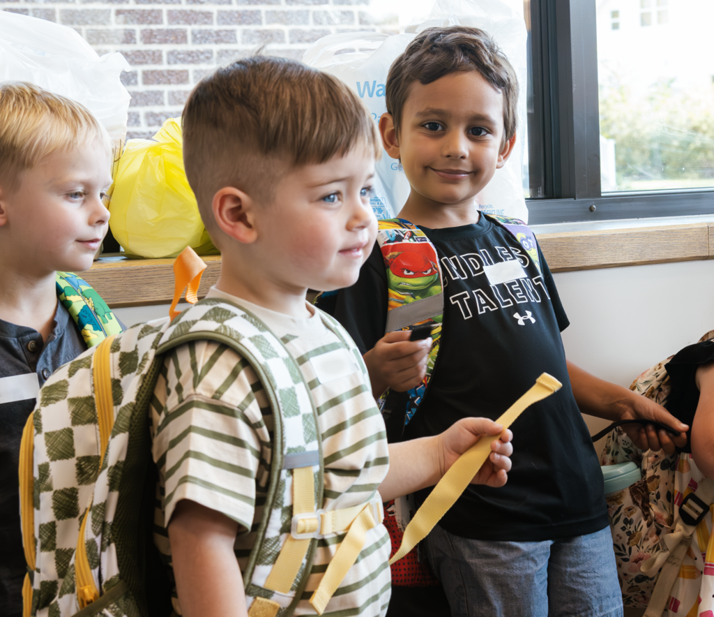 A group of preschool boys waitin the vestibule at Kramer Preschool, for their first day of school.