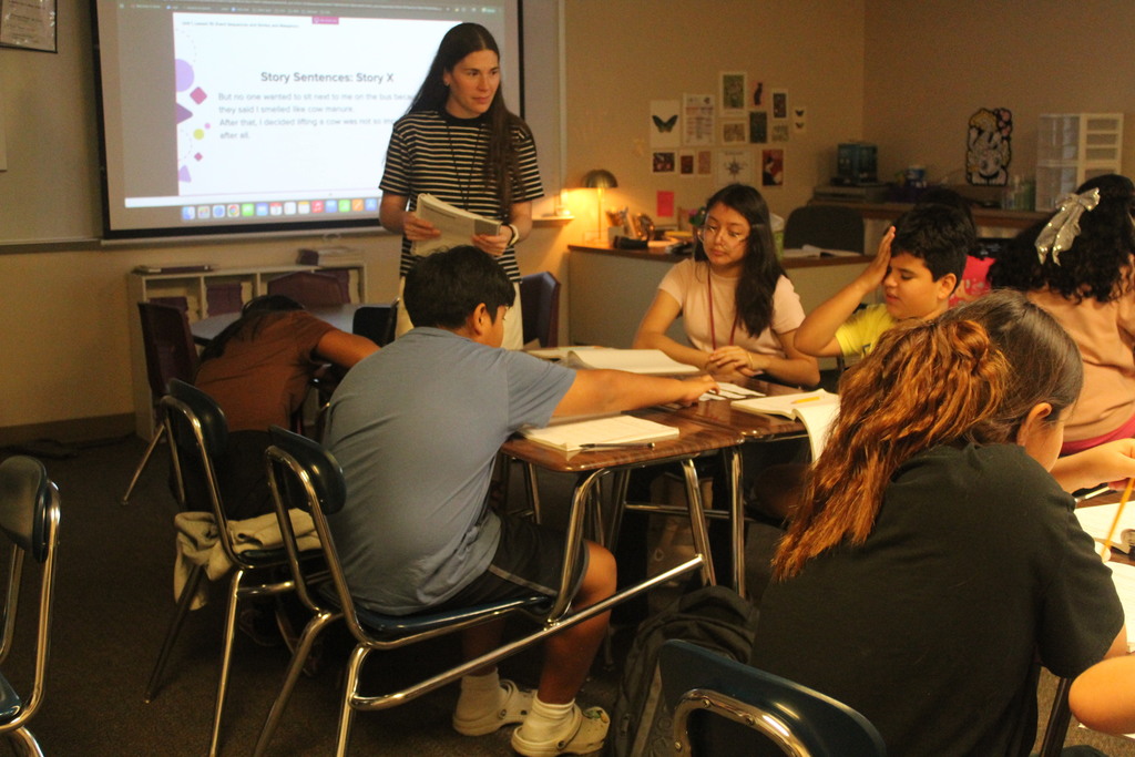 Helping her 5th Grade students