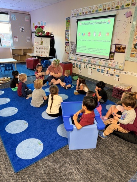 Ms. Rachel teaching during morning meeting