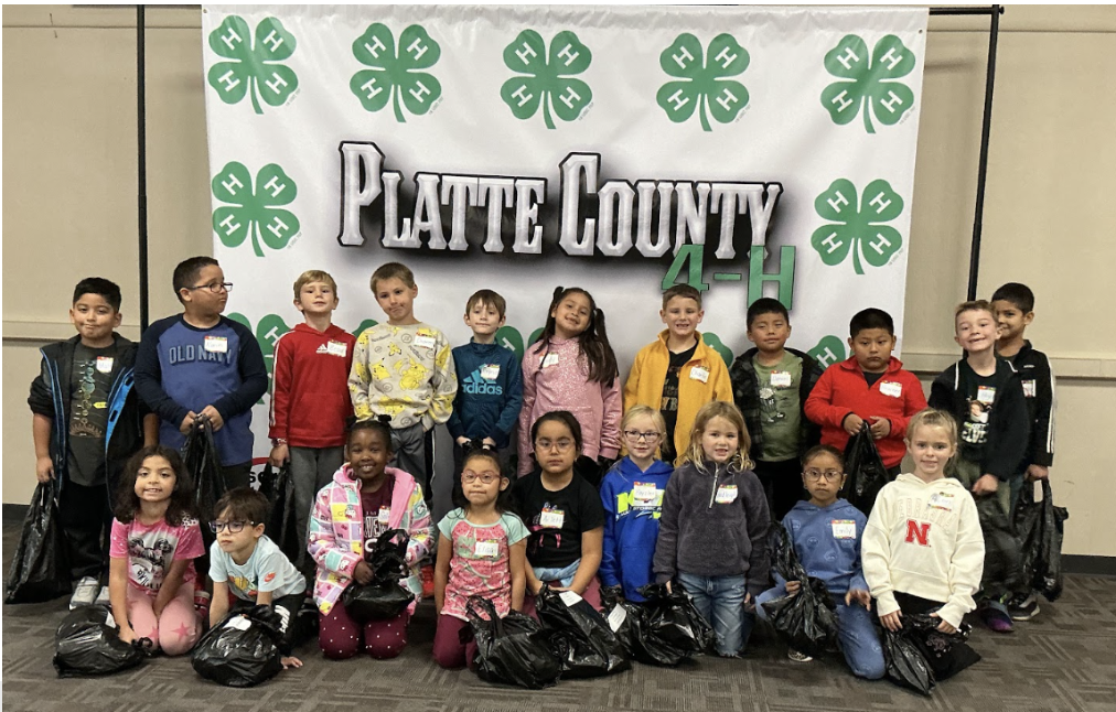 1J class in front of 4-H sign