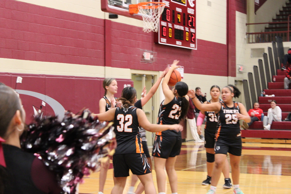 Columbus throws the ball through one of Hastings players arms in order to get the ball away.