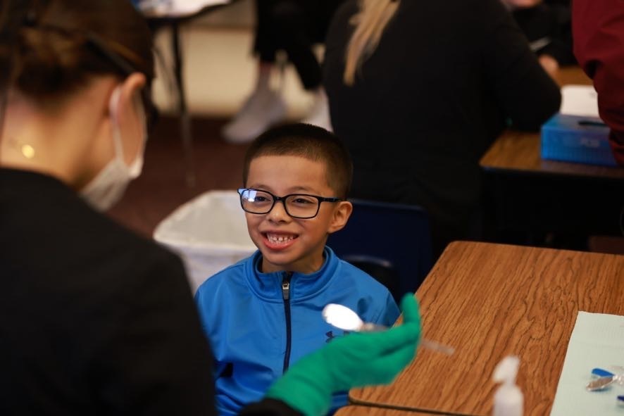 Male student learning about healthy teeth