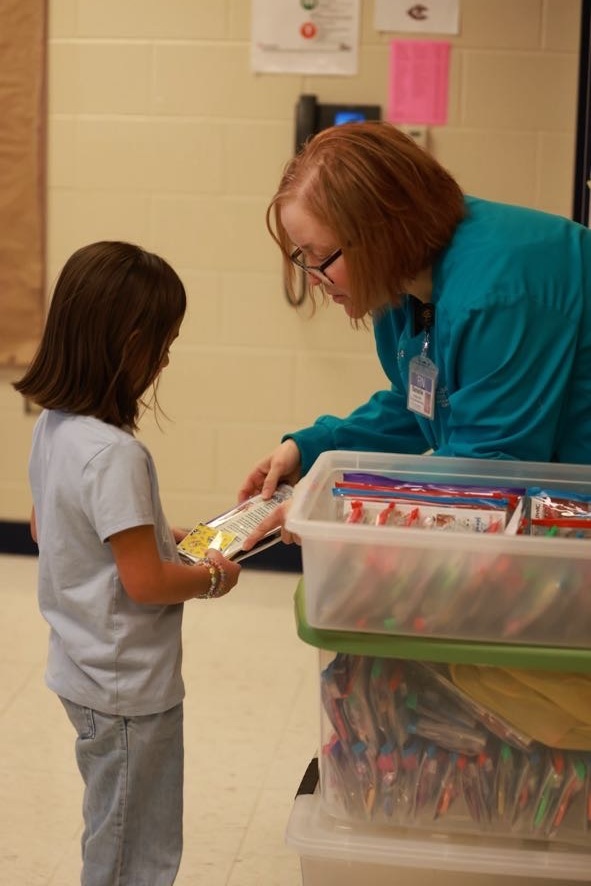Student receiving dental health care kit