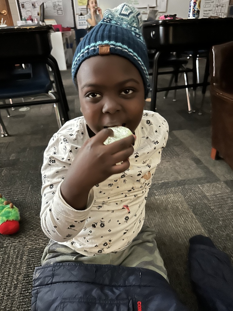 a student is eating a cookie