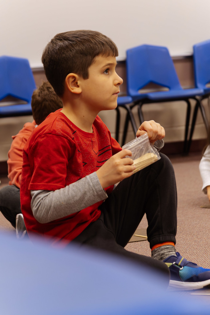a student listening intently to instructions during music class