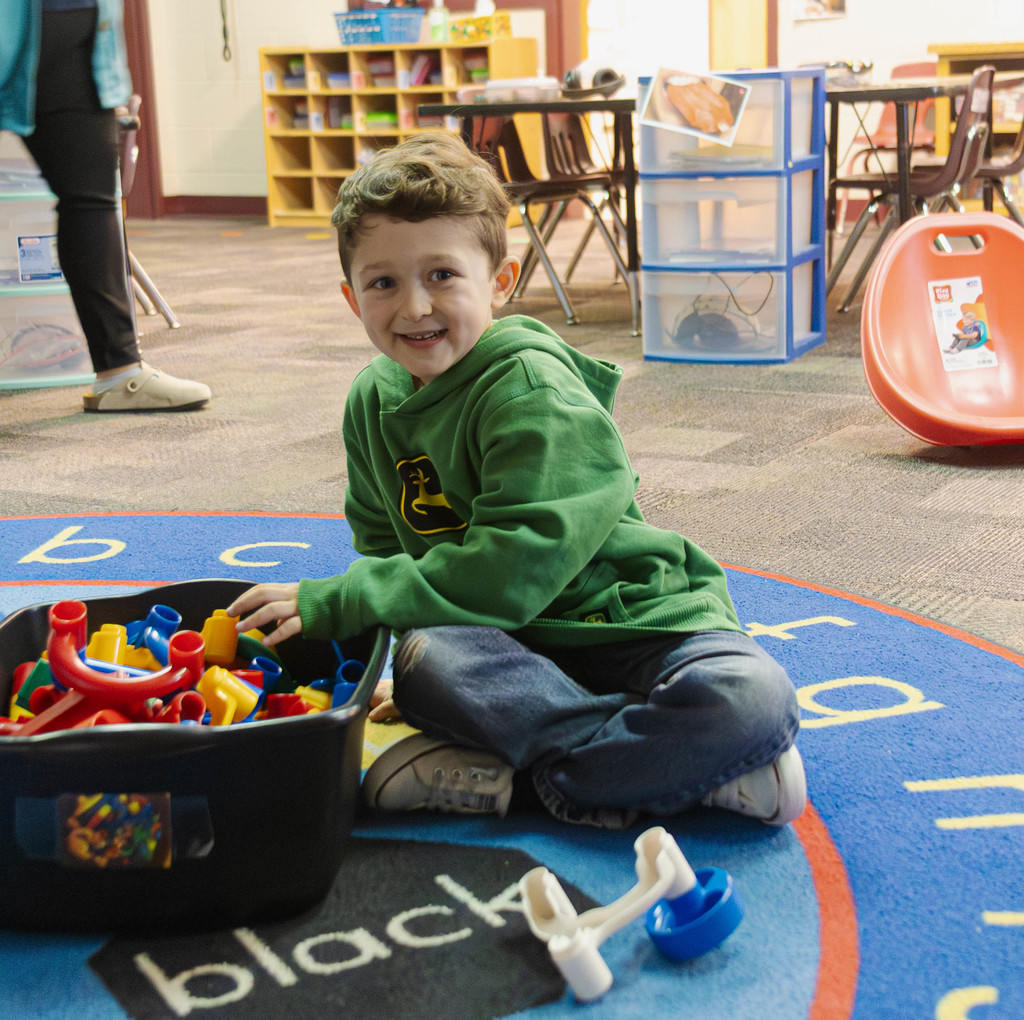a student beginning to build a marble maze