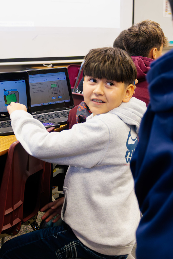 a student excited to show his work in math class