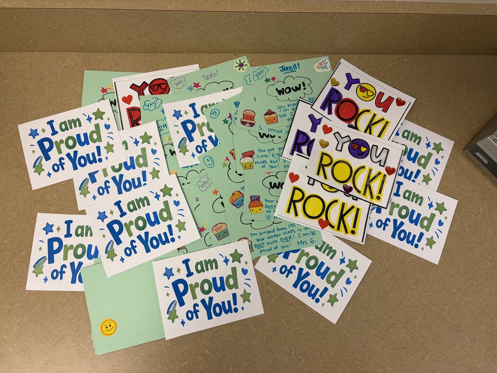 colorful postcards that were awarded to individual students who showed growth. some say I am proud of you and others You Rock!