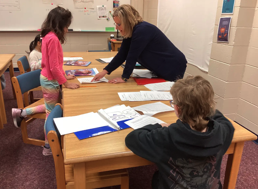 Mrs. Luchsinger helping WIN students