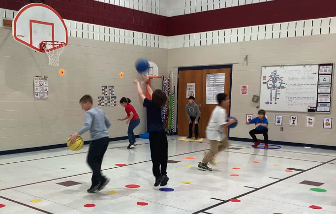 Students shooting baskets