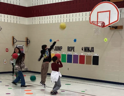 Students shooting baskets