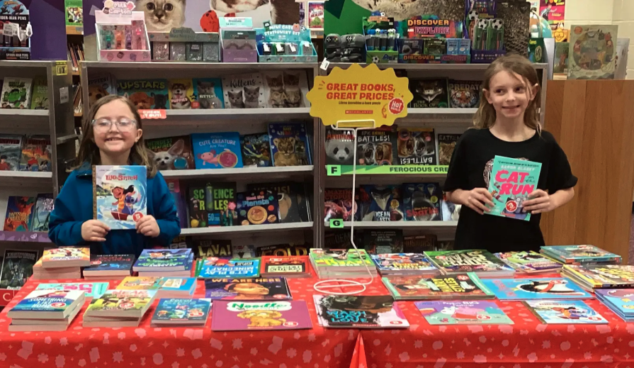 Students showing different sections of the book fair