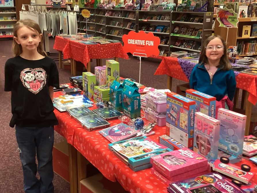 Students showing different sections of the book fair