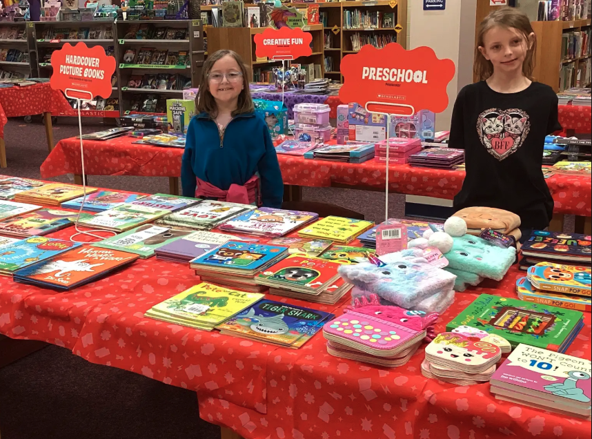 Students showing different sections of the book fair