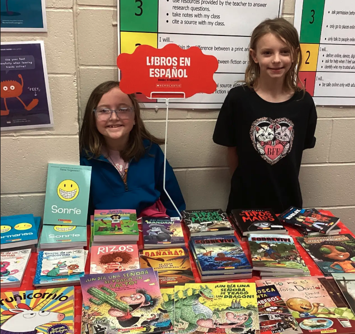 Students showing different sections of the book fair