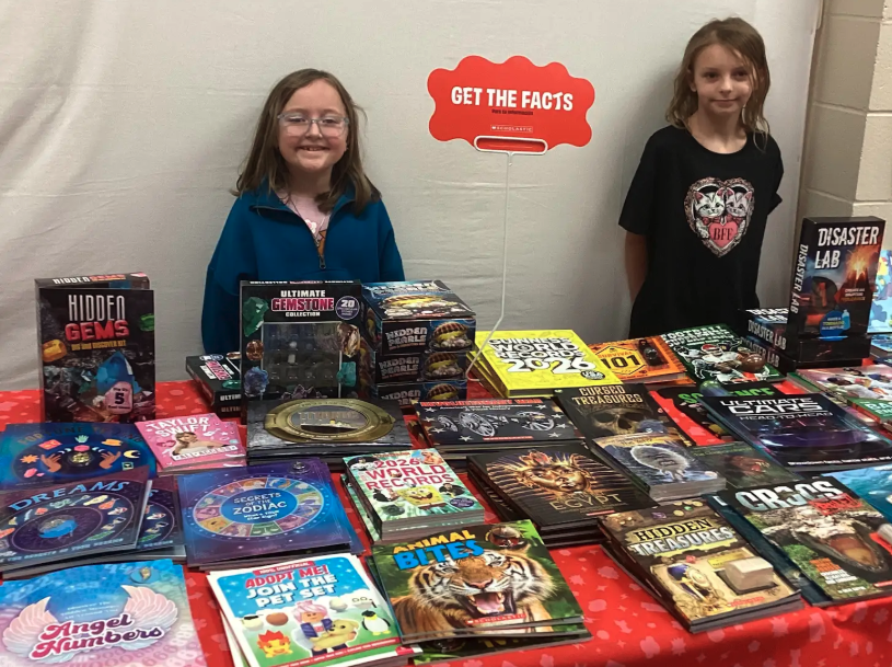 Students showing different sections of the book fair