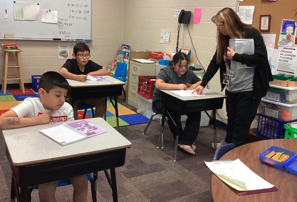 Mrs. Peterson with fourth grade students