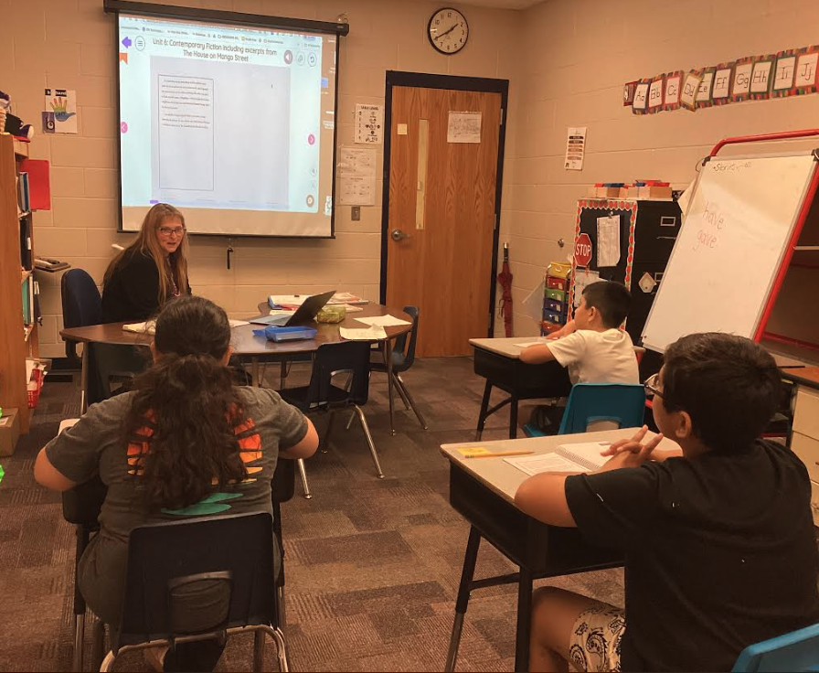 Mrs. Peterson with fourth grade students
