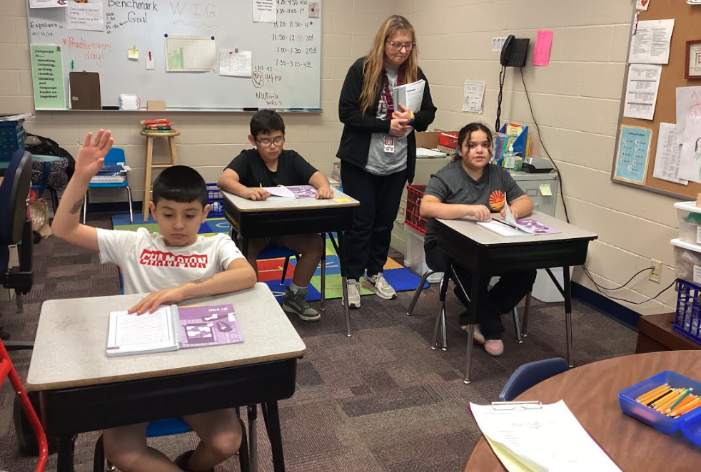 Mrs. Peterson with fourth grade students