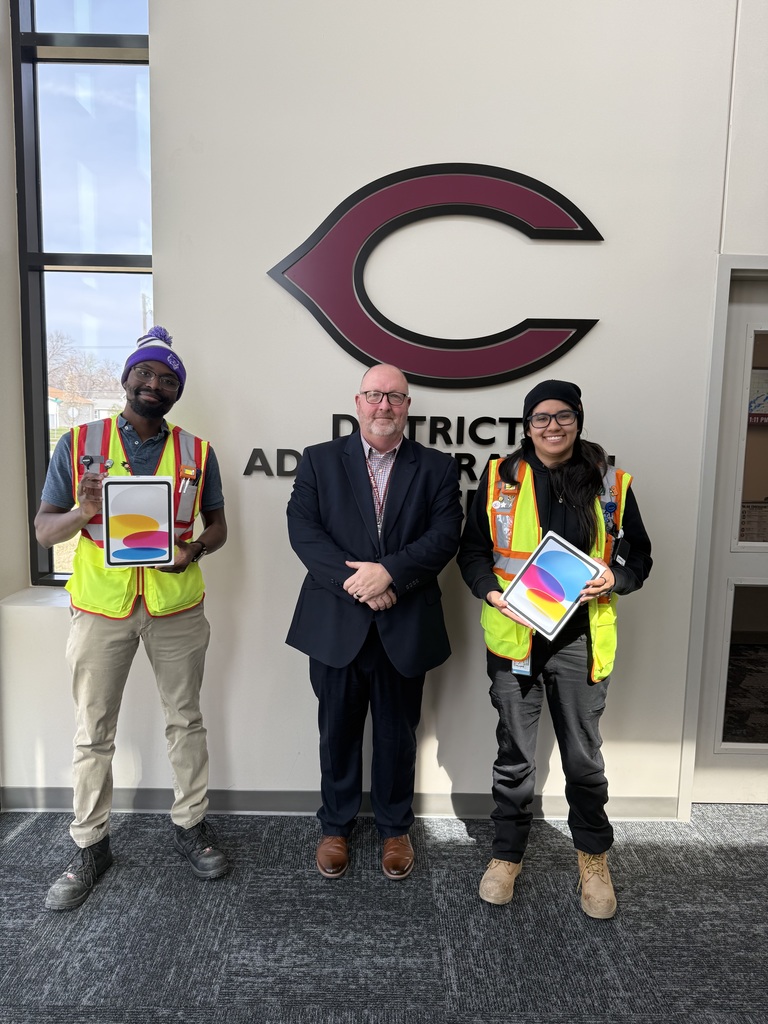 Malik, Dani and Dr. Kay taking photos with 2 of the 8 ipads donated to CPS from the local amazon branch.