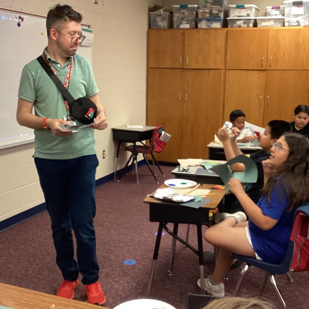 Mr. Brant talking with a fourth grader