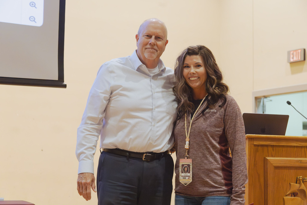 Pictured is Brian Christensen of One Nebraska Federal Credit Union and Kristin Sky of West Park after she received the New Teacher of the Year Award for 2026.