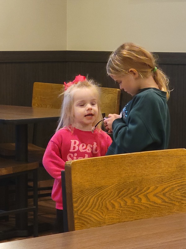Two little girls talking