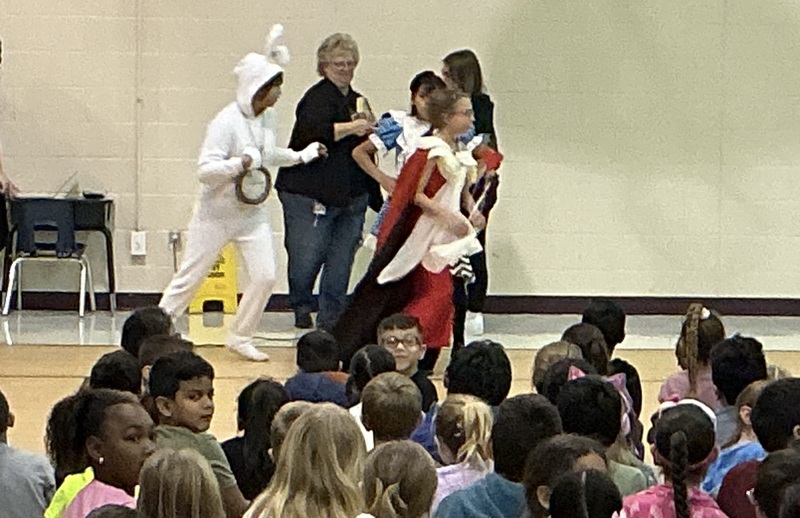 Students acting out the play, Alice in Wonderland