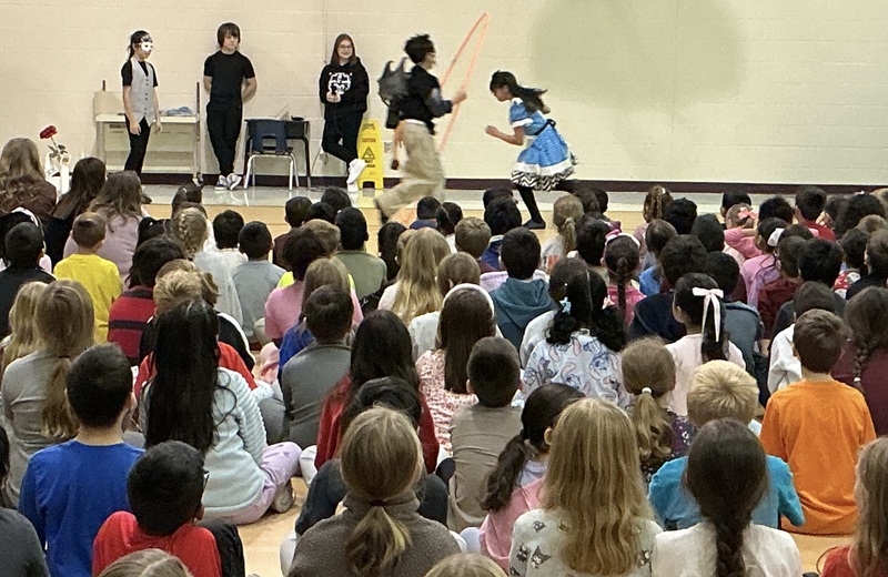 Students acting out the play, Alice in Wonderland
