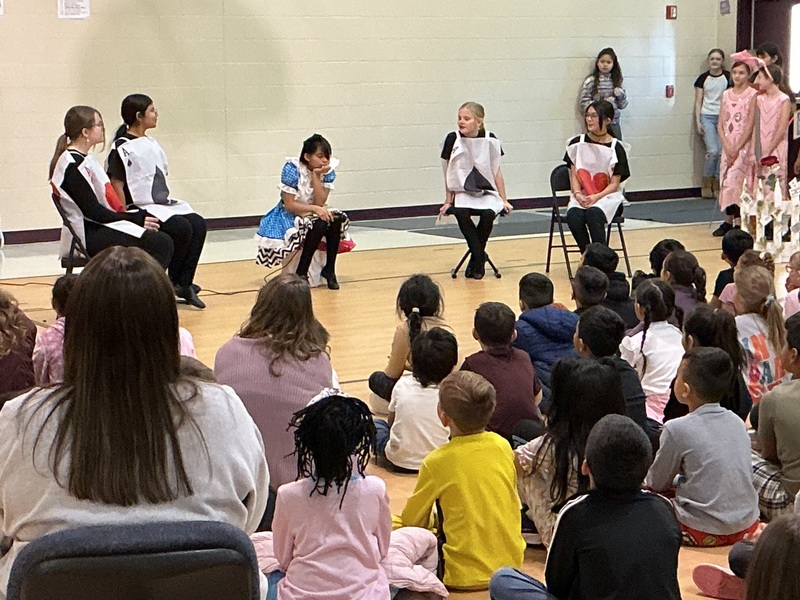 Students acting out the play, Alice in Wonderland
