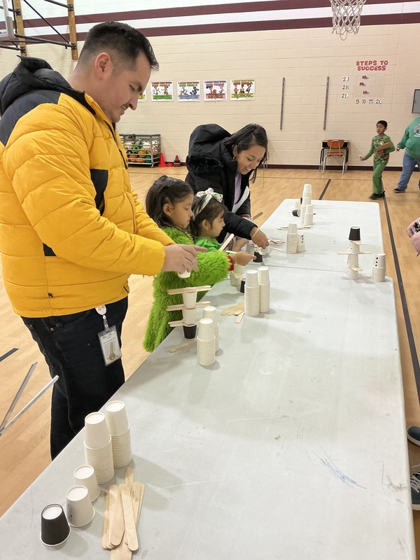 People at snowman stacking