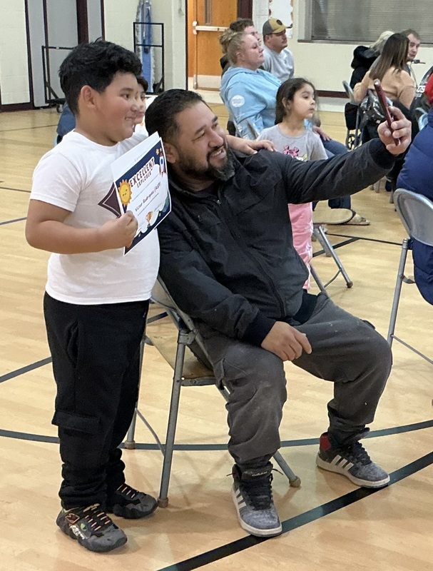 Parent taking selfie with child