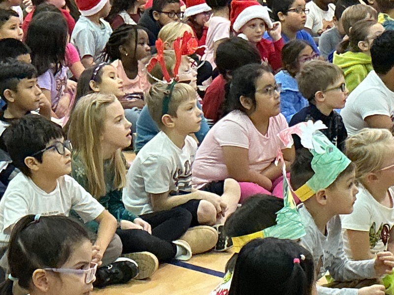 Children sitting and smiling