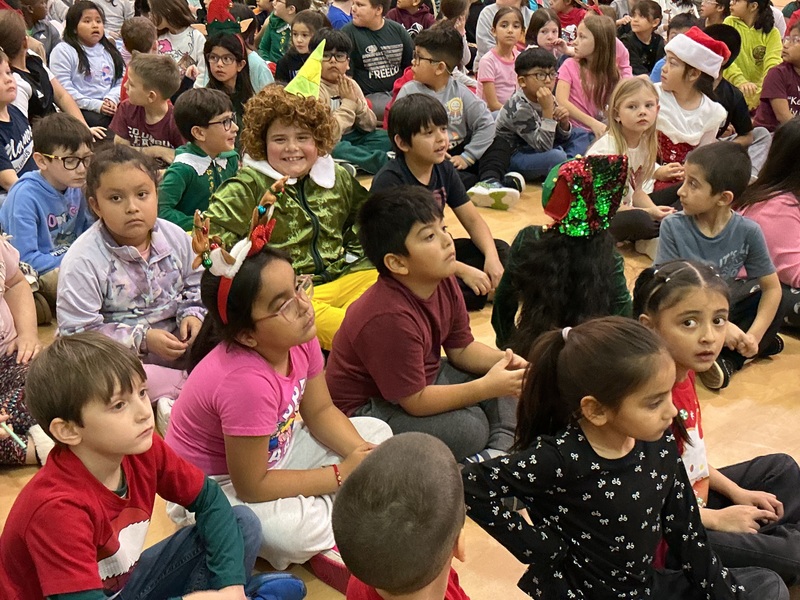 Children sitting and smiling