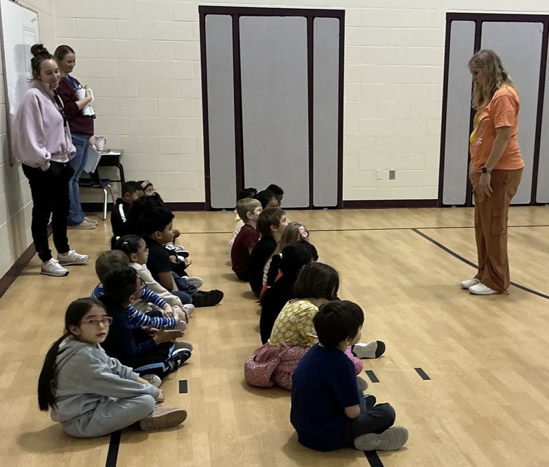 Students listening to their teacher