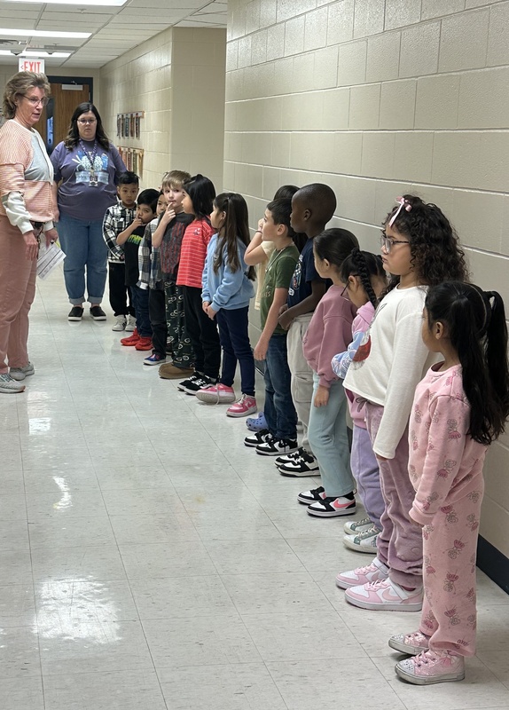 Students listening to their teacher