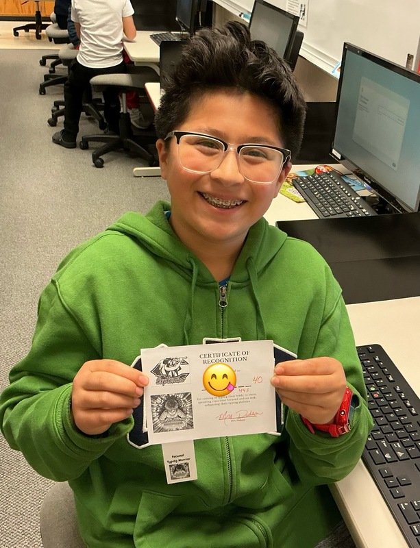 Student holiding certificate