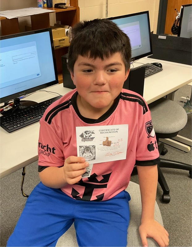 Student holiding certificate