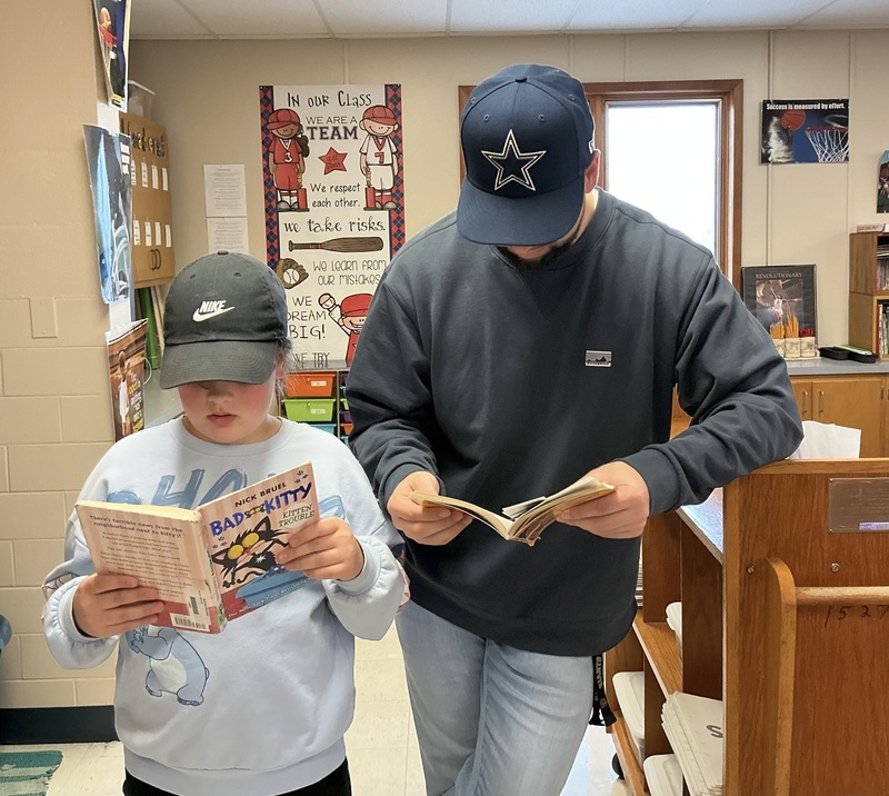 People in hats with books