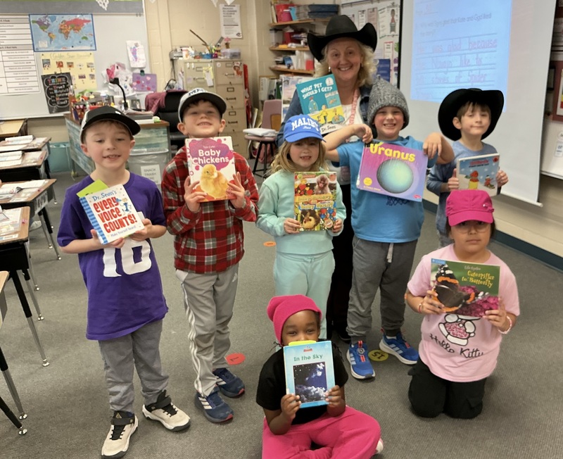 People in hats with books