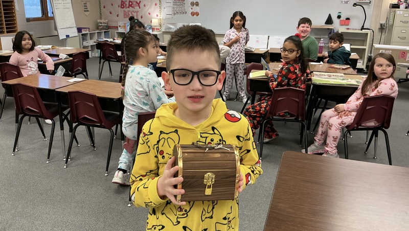 Child holding treasure chest