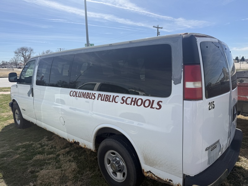 CPS van with a lift.  van is white with lots of paint missing