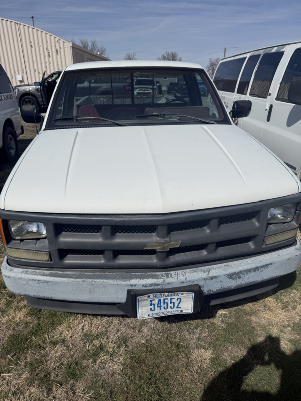 front view of white chevy pickup